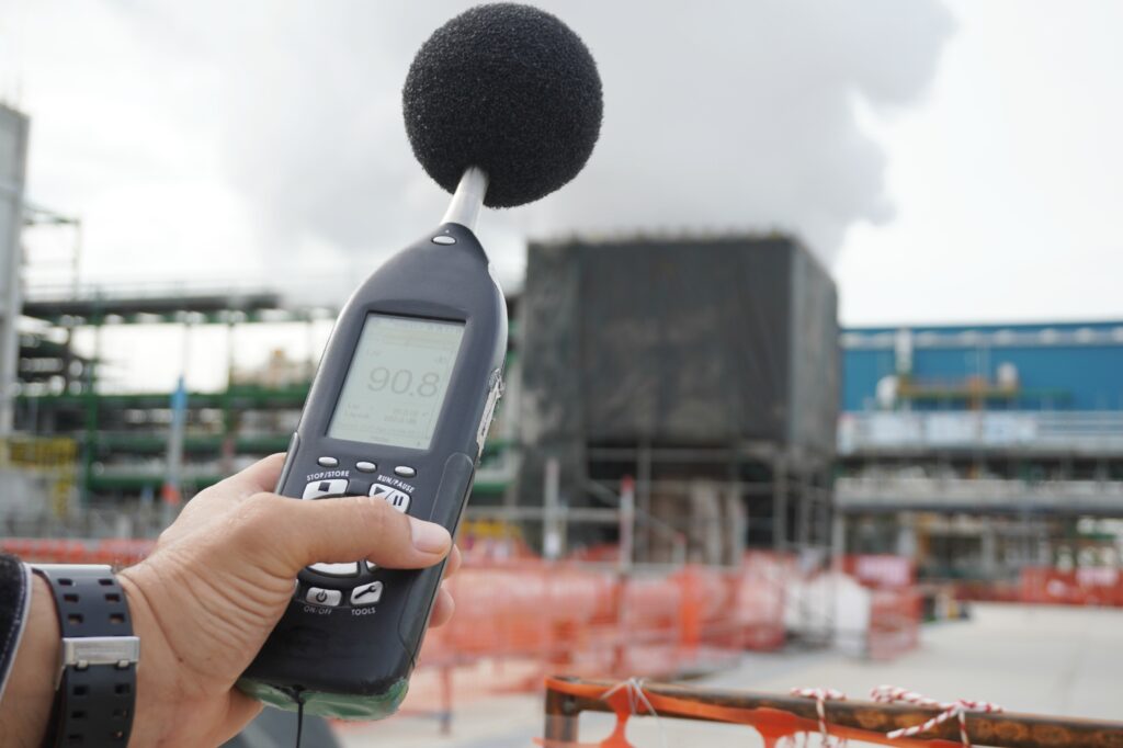 Hand of Environmental officer holding Noise Measurement device